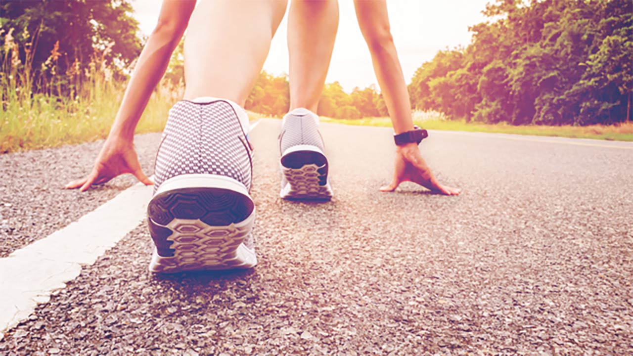 Photo of a runner at the starting line on a track
