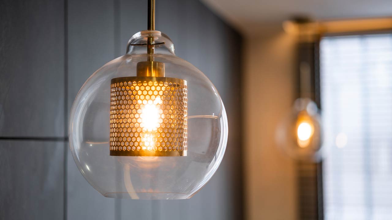 Vintage luxury interior lighting with bronze plate and transparent glass bulb