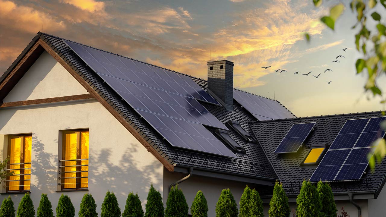 Night view of a beautiful white house with solar panels