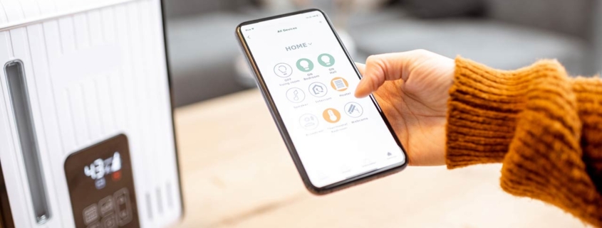 Close-up on a smart phone with launched home assistant application, controlling air humidifier at home